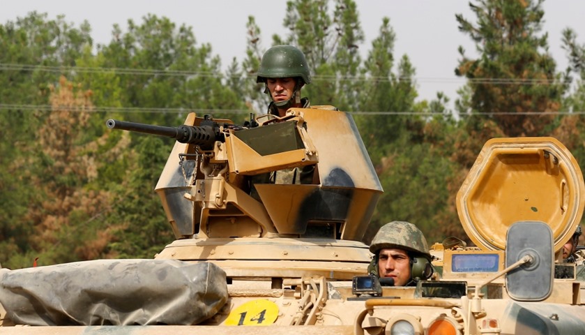 Turkish soldiers on an armoured vehicle are seen in Karkamis on the Turkish-Syrian border