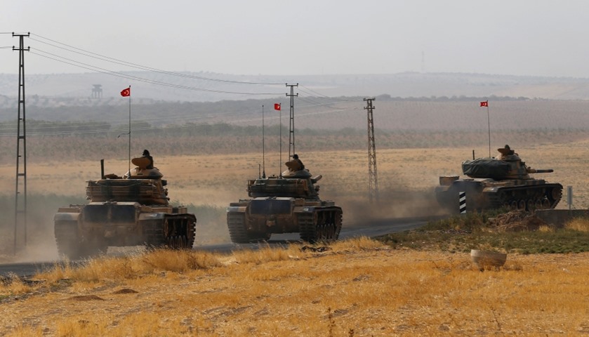 Turkish army tanks drive towards to the border in Karkamis on the Turkish-Syrian border