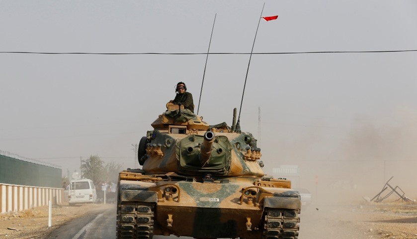 A Turkish army tank drives towards to the border in Karkamis on the Turkish-Syrian border