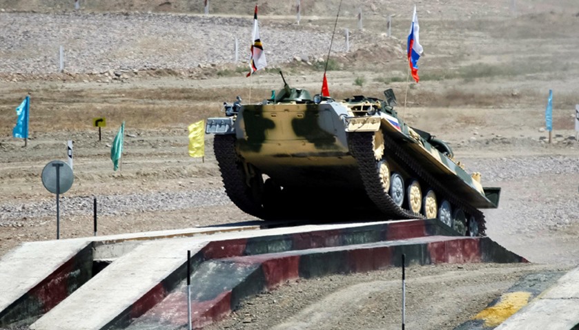 Russia army crew rides on a Light Multi-Purpose Armoured Towing Vehicle
