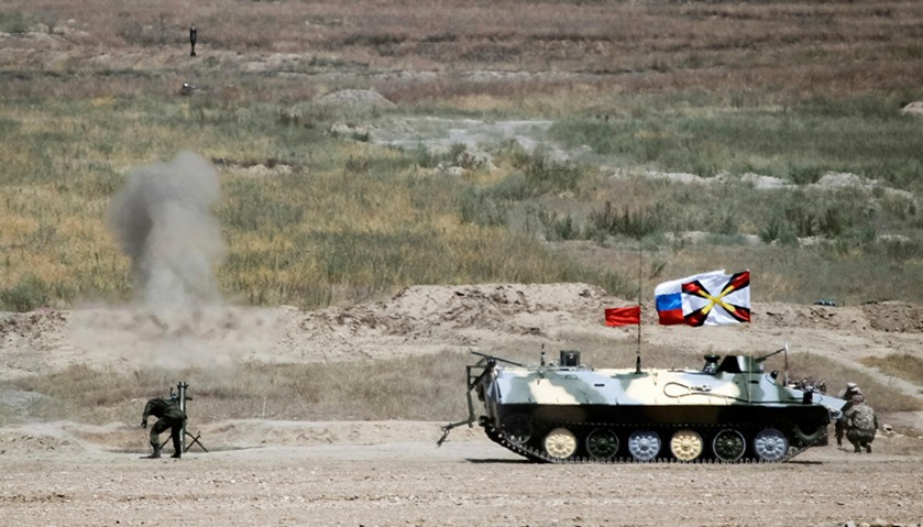 Russia army crew fires a mortar next to their Light Multi-Purpose Armoured Towing Vehicle
