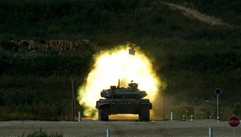 A T-72 tank, operated by a crew from Kazakhstan, fires at a target during the Tank Biathlon competit