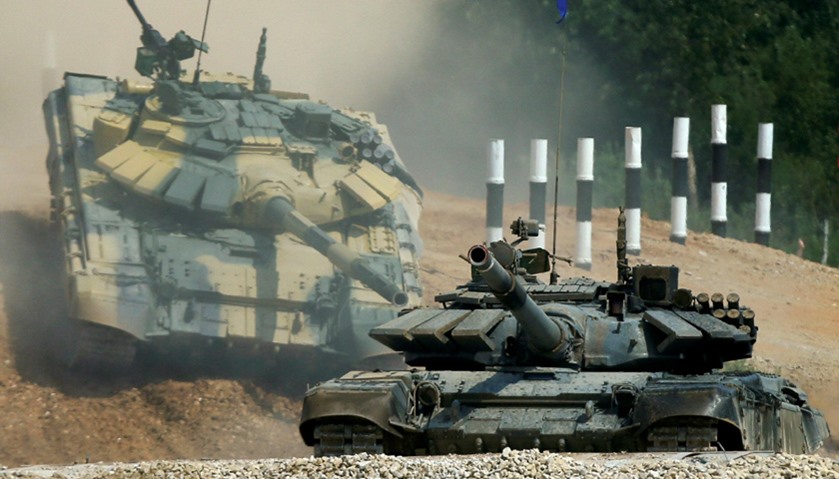T-72 tanks, operated by crews from Kuwait (front) and Nicaragua, drive during the Tank Biathlon comp