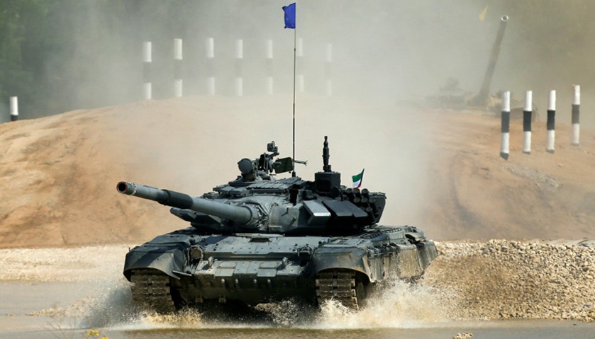 A T-72 tank, operated by a crew from Kuwait, drives during the Tank Biathlon competition