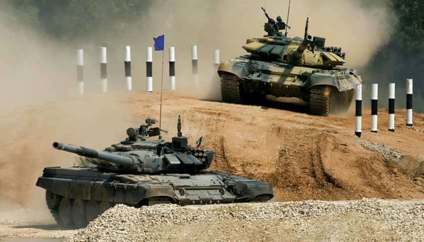 T-72 tanks, operated by crews from Kuwait (front) and Nicaragua, drive during the Tank Biathlon comp