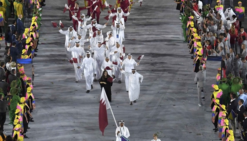 Qatar\'s flagbearer Sheikh Ali Khalid al-Thani  and the team