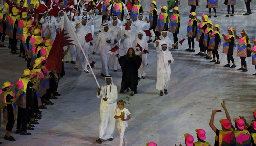 Flagbearer Sheikh Ali Khalid al-Thani leads the team