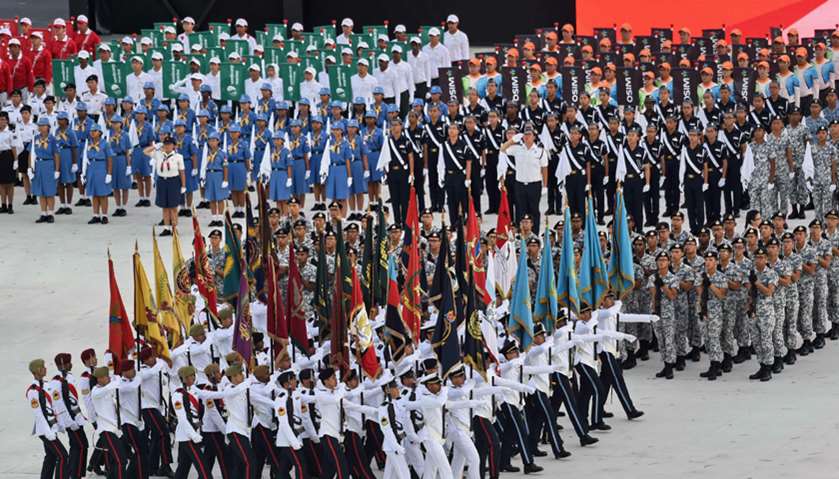 Members of various branches of the armed forces march in during the 52nd Singapore National Day para