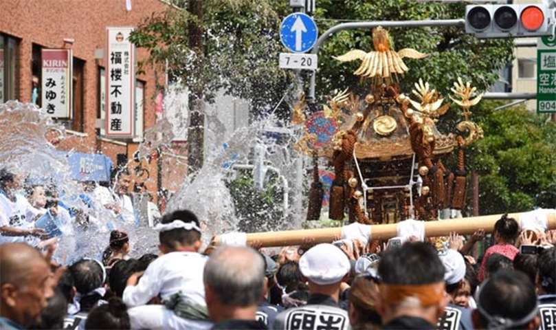 Portable shrines are paraded through the streets during the festival
