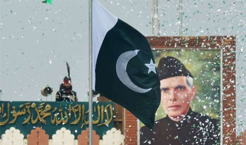 A portrait of Muhammad Ali Jinnah is seen at the India-Pakistan Wagah border post on Monday