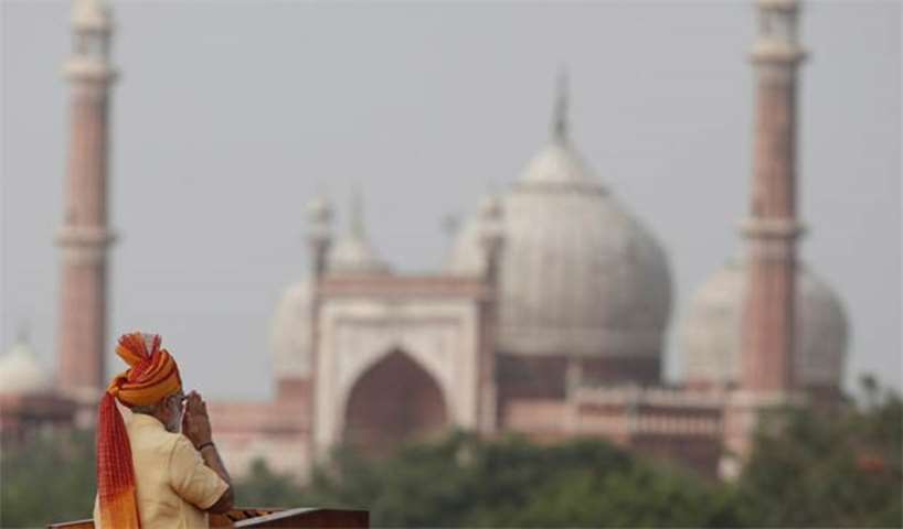 Prime Minister Narendra Modi gestures as he addresses the nation from the Red Fort in New Delhi
