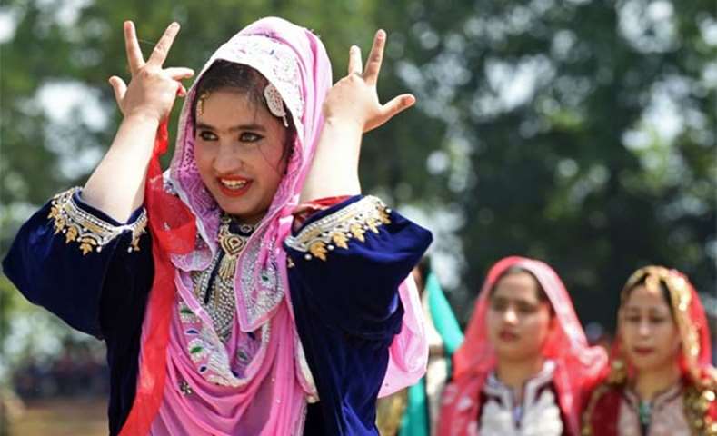 Kashmiri women dance during celebrations marking India\'s Independence Day in Srinagar