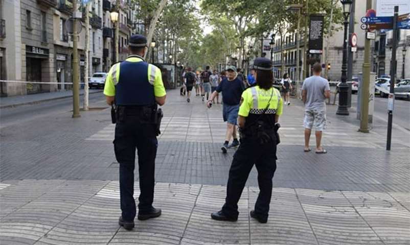 Spanish policemen stand guard on the Rambla boulevard on Friday