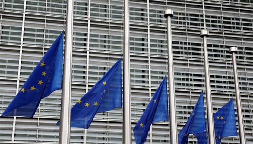 European Union flags are lowered at half-mast in honour of the attack victims, in Brussels