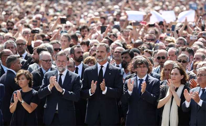 Spain\'s King Felipe and Prime Minister Mariano Rajoy observe a minute’s silence