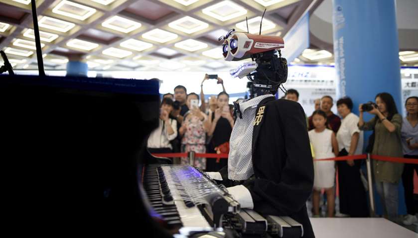 A robot called \"Teotronico\" plays the piano and sings at the 2017 World Robot Conference in Beijing