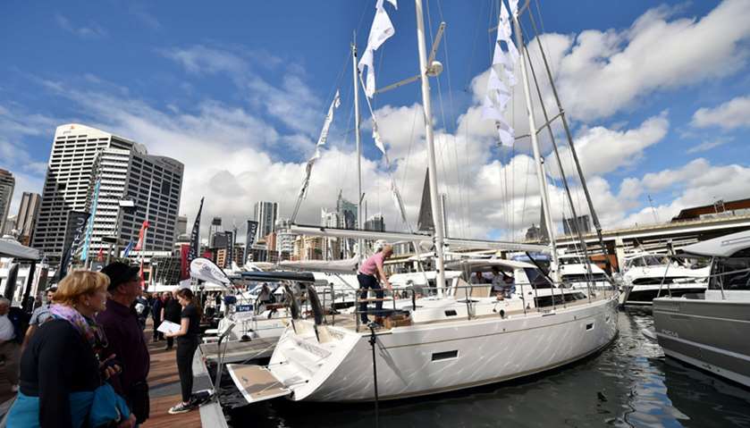 Visitors look at yachts at the Sydney International Boat Show in Darling Harbour in Sydney