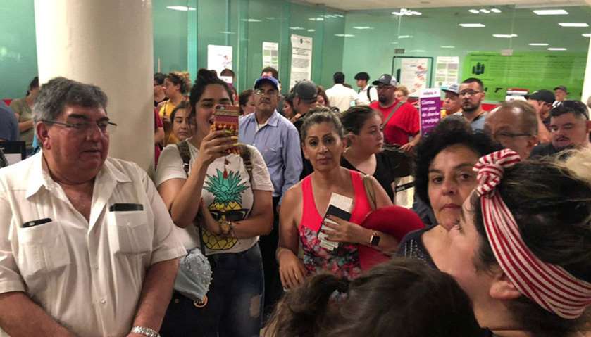 People wait in the Durango Airport after an Aeromexico-operated Embraer passenger jet crashed right 