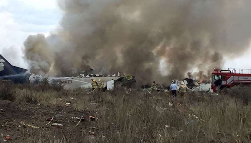 Rescue personnel work at the site where an Aeromexico-operated Embraer passenger jet crashed in Mexi