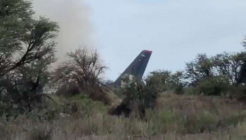 Smoke billows above an Aeromexico-operated Embraer passenger jet that crashed in Mexico