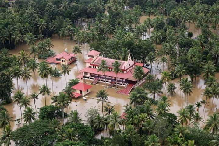 An aerial view shows partially submerged houses at a flooded area in Kerala on Friday