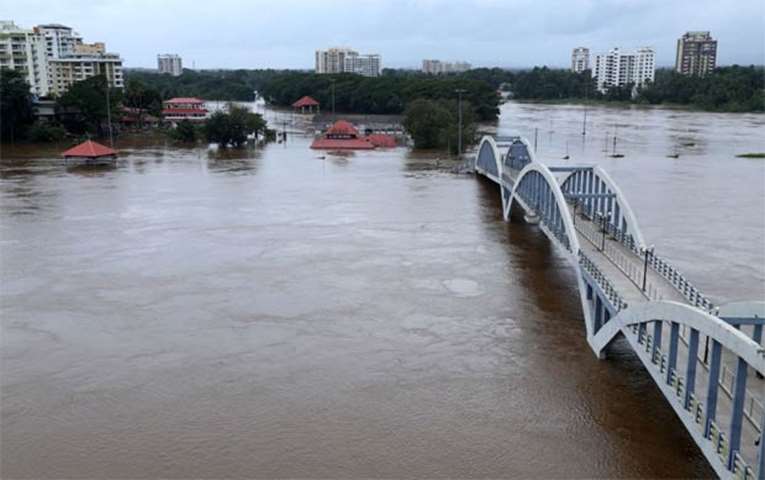 The Periyar river is flooded following heavy rains at Aluva
