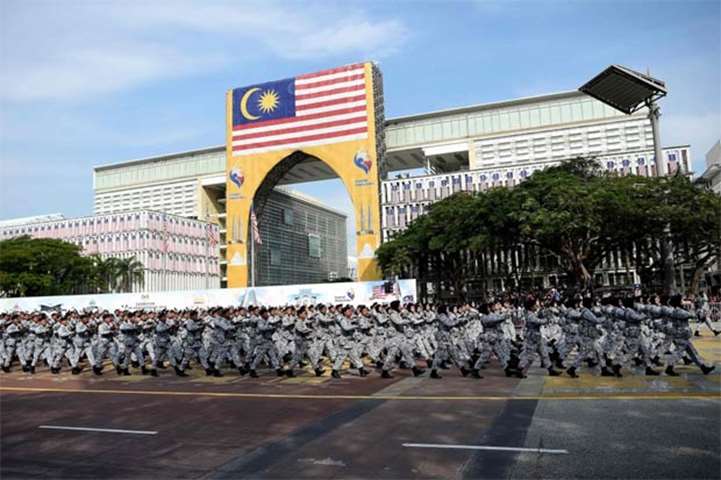 Malaysian Armed Forces personnel march during the National Day parade in Putrajaya