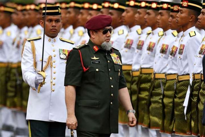 Malaysia\'s King Sultan Muhammad V inspects a guard of honour