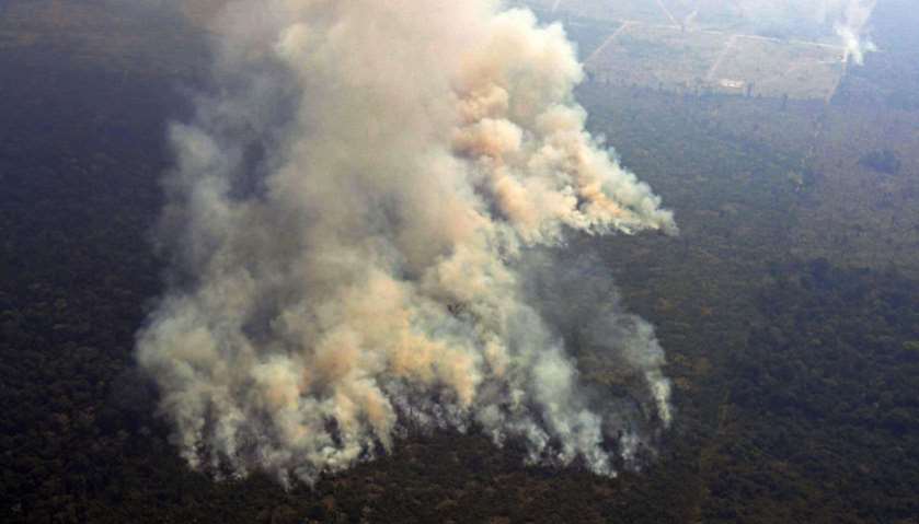 Aerial picture showing smoke from a two-kilometre-long stretch of fire billowing from the Amazon rai