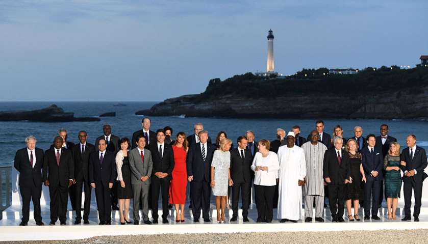 Leaders pose for a photo with invited guests during the G7 summit in Biarritz, France