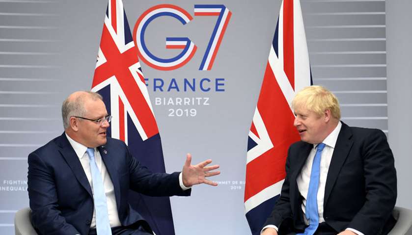 Britain\'s Prime Minister Boris Johnson (R) meets Australian Prime Minister Scott Morrison (L) for bi