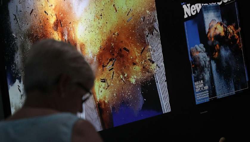 A woman browses the exhibit on the 9/11 terror attacks at the Newseum