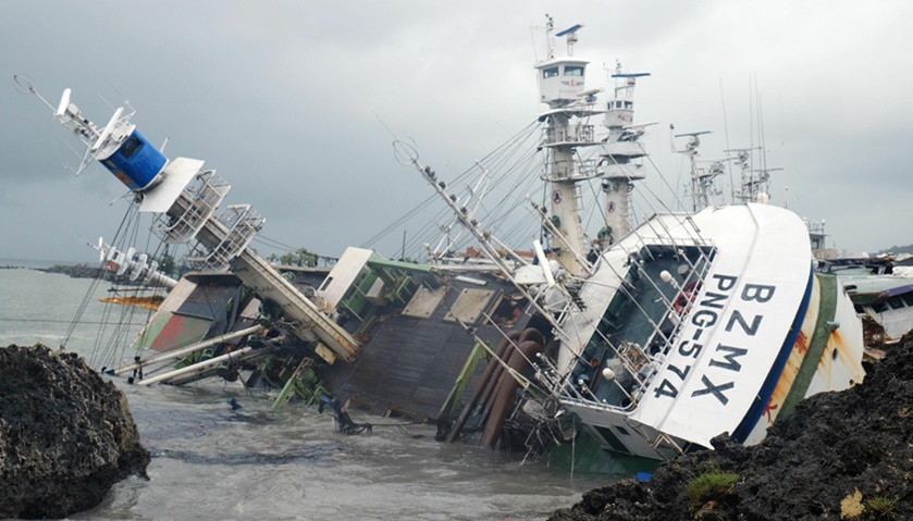 an overturned fishing boat in the aftermath of super typhoon Meranti