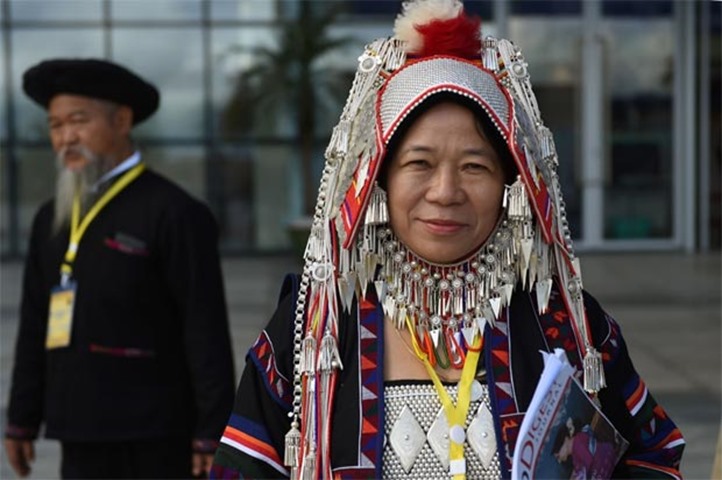 Natalina, a peace conference delegate from the Akha ethnic group, wears a traditional costume 

