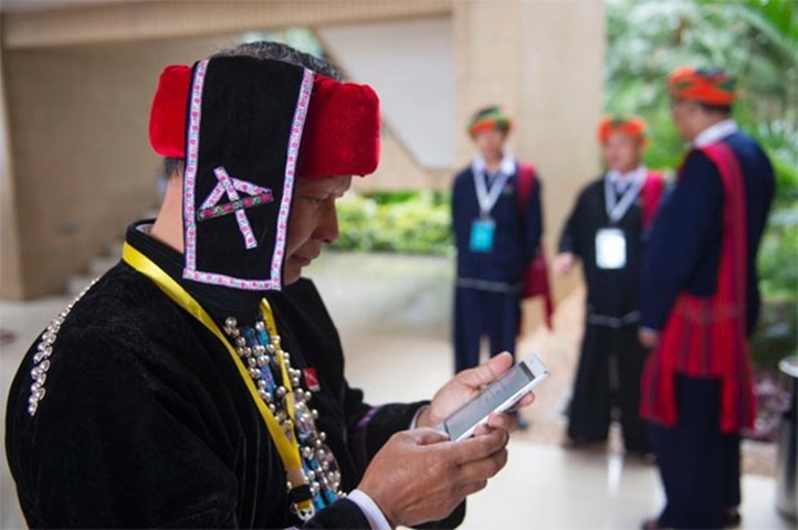 A peace conference delegate from Lisu ethnic group wears a round black hat studded with beads