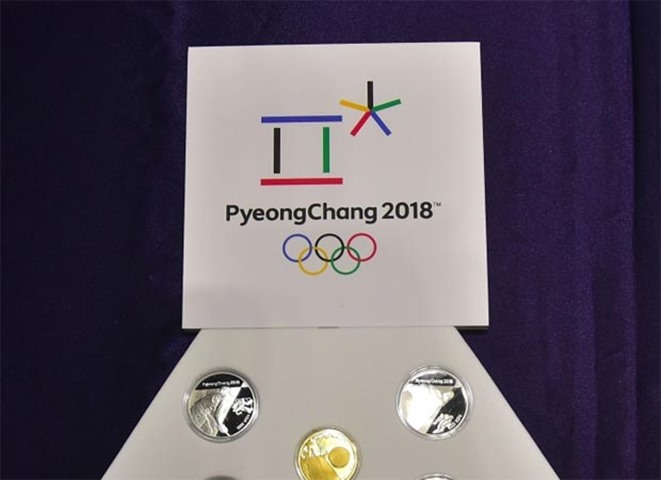 A set of commemorative coins for the winter games are on display in Seoul on Thursday