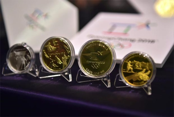 Commemorative coins for the games are displayed at an unveiling ceremony in Seoul