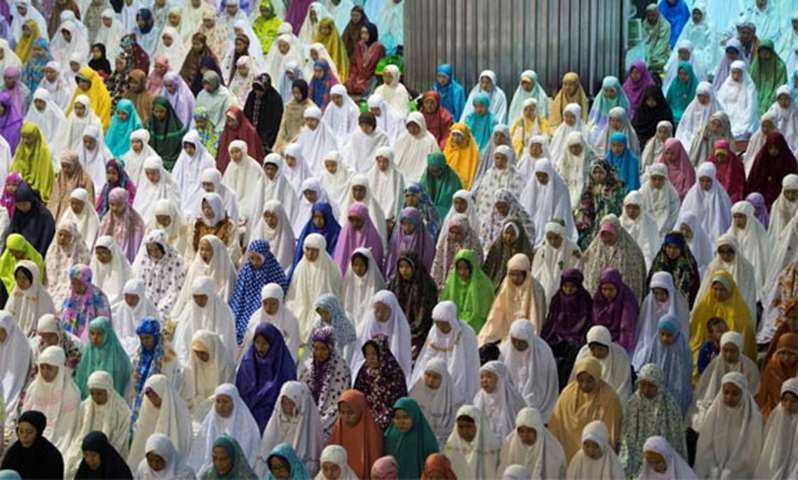 People attend Eid prayers at Istiqlal Mosque in the Indonesian capital Jakarta on Friday