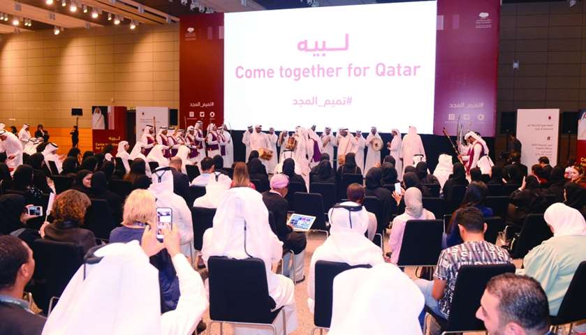 The audience enjoying a cultural performance at the event.