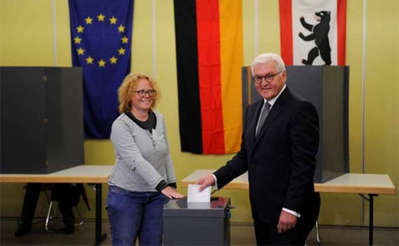 German President Frank-Walter Steinmeier casts his vote in Berlin on Sunday