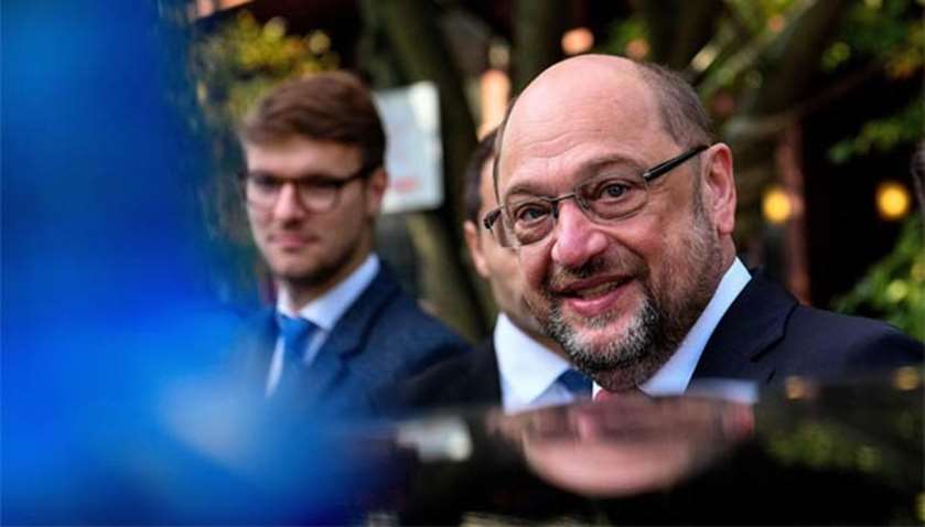 Martin Schulz, leader of SPD party, leaves after casting his vote in Wuerselen, western Germany