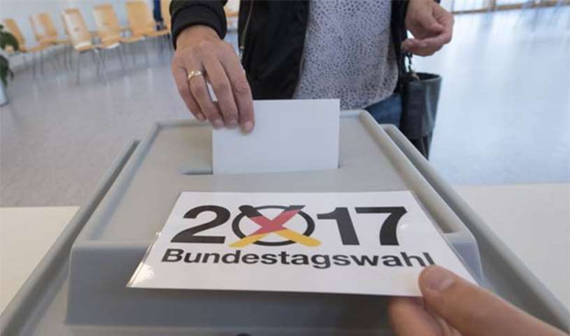 A woman casts her vote in Gutach near Freiburg, southwestern Germany