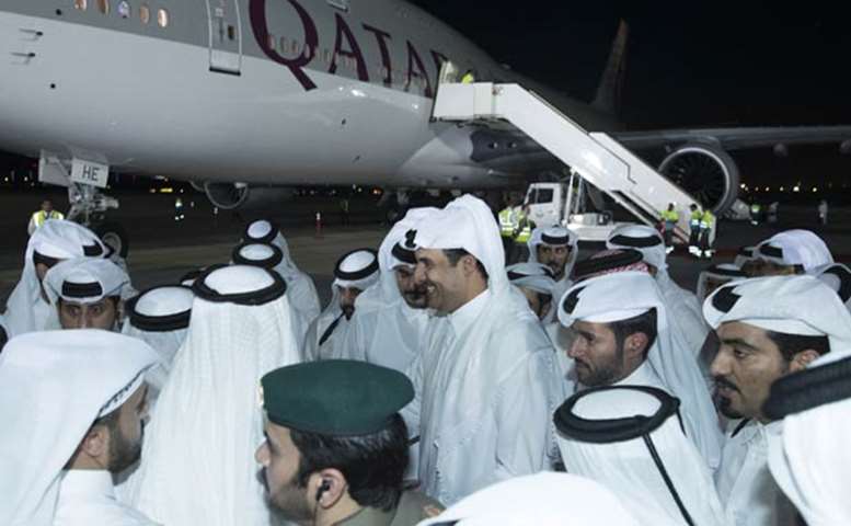 His Highness the Emir is being greeted at the Doha airport on his arrival