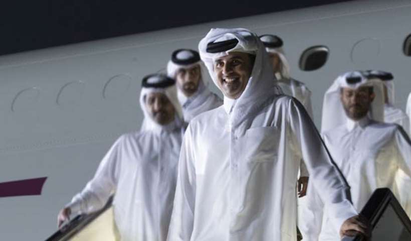 His Highness the Emir getting off the aircraft at Doha airport on Sunday