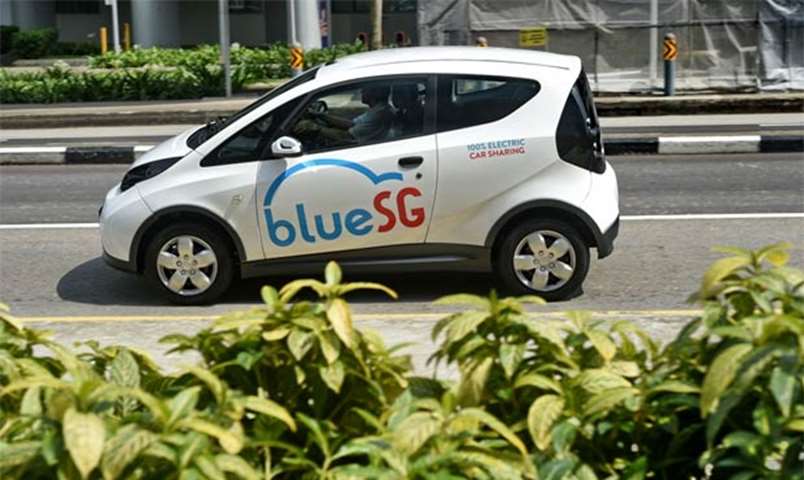 An electric Bluecar is taken for a test drive during the launch of BlueSG office in Singapore