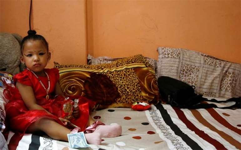 Newly appointed Living Goddess Kumari of Kathmandu Trishna Shakya, 3, is pictured in her house