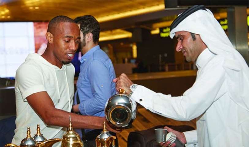 A traveller is treated to Arabic coffee at HIA upon his arrival