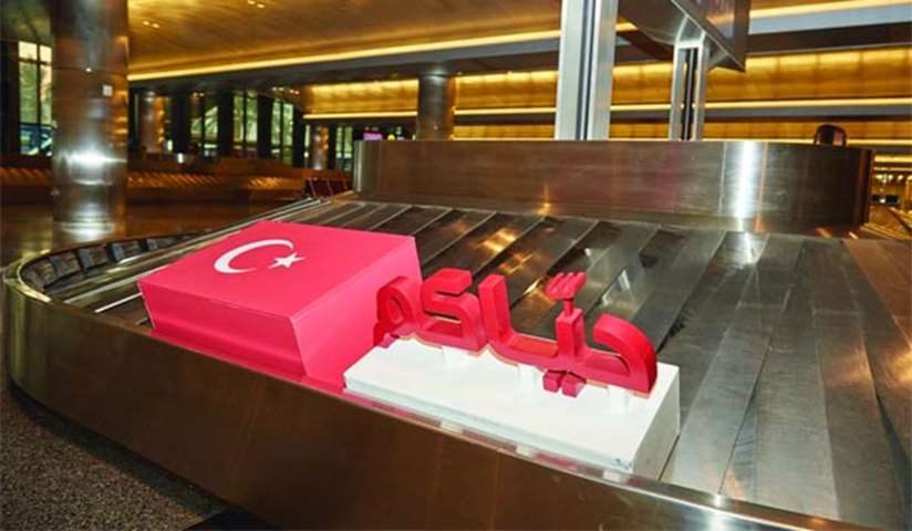 A design of the Turkish national flag is seen on a conveyor belt at HIA