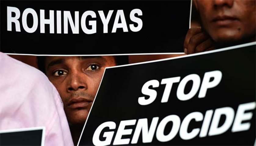 Rohingyas hold placards against human rights violations in Myanmar during a protest in New Delhi