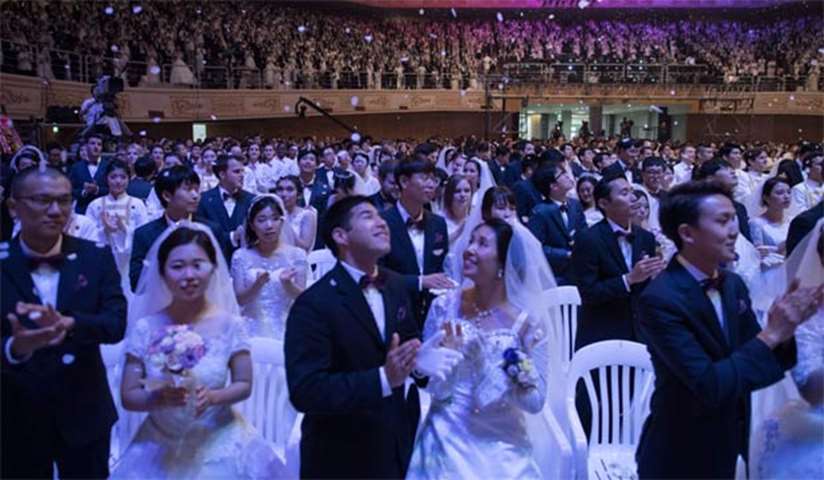 Confetti falls over couples during a mass wedding ceremony in Gapyeong on Thursday